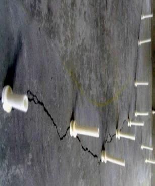 Resin injection ports on a concrete crack