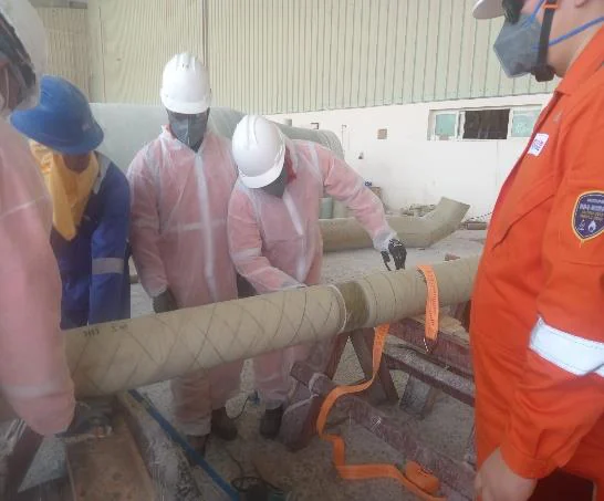 Crew installing non-metallic pipe