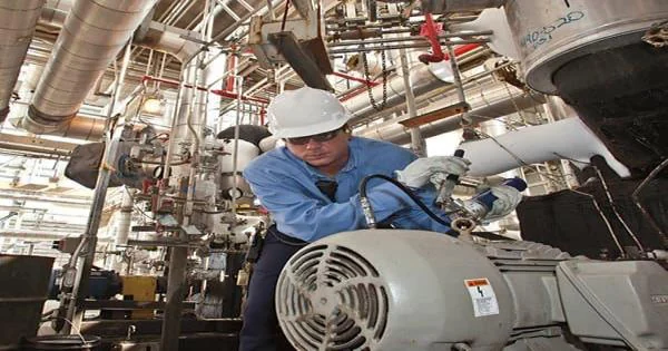 Technician servicing rotating equipment
